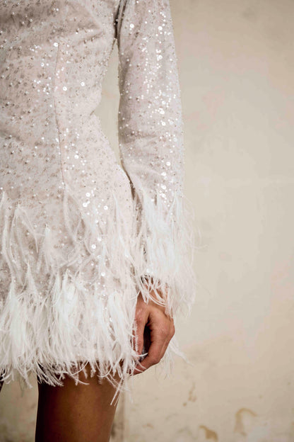 Close-up of sequin sleeve and ostrich feather hemline on Apollo dress, Sadie Bosworth Atelier
